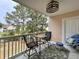 Relaxing balcony with a view featuring comfortable seating, ceiling fan, and tiled flooring at 3979 Forsythia Ct. # 203, Myrtle Beach, SC 29588