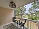 Balcony overlooking a beautiful pond with trees and outdoor seating at 3979 Forsythia Ct. # 203, Myrtle Beach, SC 29588