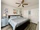 Bedroom with a king bed, ceiling fan, and coastal-themed decor at 3979 Forsythia Ct. # 203, Myrtle Beach, SC 29588