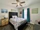 Cozy bedroom featuring a bed, palm tree dresser, and beach-themed decor at 3979 Forsythia Ct. # 203, Myrtle Beach, SC 29588