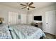 Relaxing bedroom with a king bed, ceiling fan, and closet doors at 3979 Forsythia Ct. # 203, Myrtle Beach, SC 29588