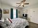 Cozy bedroom with a nautical themed comforter set and a ceiling fan at 3979 Forsythia Ct. # 203, Myrtle Beach, SC 29588