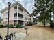 Charming condo building features multiple screened-in balconies and outdoor grilling area at 3979 Forsythia Ct. # 203, Myrtle Beach, SC 29588