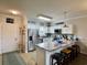 Bright kitchen with stainless steel appliances, breakfast bar, and bar seating at 3979 Forsythia Ct. # 203, Myrtle Beach, SC 29588
