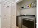 Laundry room featuring front loading washer and dryer set with wire shelving at 3979 Forsythia Ct. # 203, Myrtle Beach, SC 29588