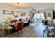 Living room with modern coastal decor, luxury vinyl floors, and sliding door to balcony at 3979 Forsythia Ct. # 203, Myrtle Beach, SC 29588