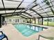 Enclosed community pool ensures year-round swimming, featuring lounge chairs and bright natural light at 3979 Forsythia Ct. # 203, Myrtle Beach, SC 29588