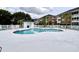Relaxing community pool area features lounge chairs, a storage house and ample deck space at 3979 Forsythia Ct. # 203, Myrtle Beach, SC 29588