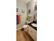 Well-lit bathroom with a white toilet, black countertop, and neutral-toned walls and flooring at 415 Ocean Creek Dr. # 2216, Myrtle Beach, SC 29572