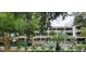 Lovely exterior view of the condo with a serene pool and surrounding green landscape, creating a relaxing vacation getaway at 415 Ocean Creek Dr. # 2216, Myrtle Beach, SC 29572