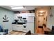 Compact kitchen with white cabinets, modern appliances, and adjacent dining area, ideal for preparing meals and entertaining at 415 Ocean Creek Dr. # 2216, Myrtle Beach, SC 29572
