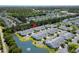 Aerial view of neighborhood surrounded by lush trees and tranquil waters at 432 Warrington Way # 432, Murrells Inlet, SC 29576