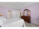 Bedroom with a white bed, dresser, and access to a bathroom with tile shower at 432 Warrington Way # 432, Murrells Inlet, SC 29576