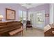Cozy sunroom with carpet flooring, two windows, a piano, a bench, and an accent chair at 432 Warrington Way # 432, Murrells Inlet, SC 29576