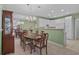 Bright dining area adjacent to the kitchen, complete with modern lighting and ample seating at 432 Warrington Way # 432, Murrells Inlet, SC 29576