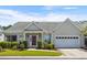 Charming single-story home with a well-manicured lawn, brick accents, and an attached two-car garage at 432 Warrington Way # 432, Murrells Inlet, SC 29576
