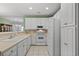 Spacious kitchen featuring white appliances, ample cabinetry, and a tiled floor at 432 Warrington Way # 432, Murrells Inlet, SC 29576
