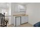 Kitchenette with sink, cabinets, and mini-fridge in bonus room at 432 Warrington Way # 432, Murrells Inlet, SC 29576
