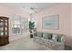 Cozy living room with large windows, a ceiling fan, and comfortable seating, great for relaxing at 432 Warrington Way # 432, Murrells Inlet, SC 29576