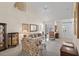 Inviting living room with vaulted ceiling, carpet, and a view of the front door and staircase at 432 Warrington Way # 432, Murrells Inlet, SC 29576