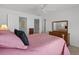 Bright main bedroom features a ceiling fan, and an ensuite bathroom at 432 Warrington Way # 432, Murrells Inlet, SC 29576