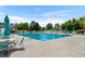 Relaxing pool with comfortable seating surrounded by tall mature trees at 432 Warrington Way # 432, Murrells Inlet, SC 29576