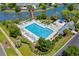 Aerial view of sparkling pool with seating and a charming lakeside gazebo at 432 Warrington Way # 432, Murrells Inlet, SC 29576
