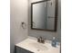 Cozy bathroom featuring a mirror, sink, and modern fixtures at 4350 Intercoastal Dr. # 2302, Little River, SC 29566