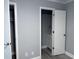 A bedroom with a door to the bathroom and closet at 4350 Intercoastal Dr. # 2302, Little River, SC 29566
