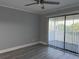Spacious bedroom with modern flooring and sliding glass doors to a balcony at 4350 Intercoastal Dr. # 2302, Little River, SC 29566