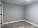 Spacious bedroom with gray plank floors at 4350 Intercoastal Dr. # 2302, Little River, SC 29566