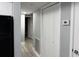 Hallway view with closets, kitchen, and laundry room access at 4350 Intercoastal Dr. # 2302, Little River, SC 29566
