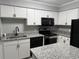 Modern kitchen featuring stainless steel appliances, granite counters, and white cabinets at 4350 Intercoastal Dr. # 2302, Little River, SC 29566