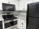 Updated kitchen featuring stainless steel appliances, granite countertops and white cabinets at 4350 Intercoastal Dr. # 2302, Little River, SC 29566