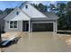 Charming craftsman-style home featuring a newly poured driveway and an attached two-car garage at 440 Sun Colony Blvd., Longs, SC 29568