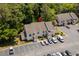 Aerial view of condominiums with ample parking and lush green surroundings at 4470 Little River Inn Ln. # 1005, Little River, SC 29566