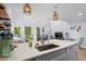 Modern kitchen with a breakfast bar, open shelving, and plenty of natural light at 4470 Little River Inn Ln. # 1005, Little River, SC 29566