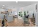 Open-concept living room and kitchen area with modern decor and plenty of natural light at 4470 Little River Inn Ln. # 1005, Little River, SC 29566