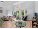 Inviting living room with vaulted ceilings and sliding doors leading to the outdoor area at 4470 Little River Inn Ln. # 1005, Little River, SC 29566