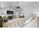 Serene main bedroom with vaulted ceiling, seating, ceiling fan and a view of a large television at 4470 Little River Inn Ln. # 1005, Little River, SC 29566