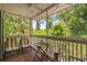 Relaxing screened-in patio with wood floors, ceiling fan, comfortable seating and tranquil view at 4470 Little River Inn Ln. # 1005, Little River, SC 29566