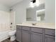 Well-lit bathroom features a shower-tub combination and a modern vanity with a large mirror at 469 Overcrest St., Myrtle Beach, SC 29579