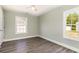 Serene bedroom with wood floors, white trim, and ample natural light at 469 Overcrest St., Myrtle Beach, SC 29579