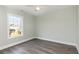 This bedroom has a ceiling fan, wood-look floors and a sun-filled window at 469 Overcrest St., Myrtle Beach, SC 29579