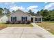 Charming single-story home with a well-manicured lawn and concrete driveway at 469 Overcrest St., Myrtle Beach, SC 29579