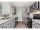 Contemporary kitchen with stainless steel appliances, gray cabinets, and modern countertops at 469 Overcrest St., Myrtle Beach, SC 29579