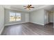 Inviting living room with wood floors, large windows, and a ceiling fan at 469 Overcrest St., Myrtle Beach, SC 29579