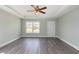 Bright living room with gray floors, tray ceilings and natural light from a large window at 469 Overcrest St., Myrtle Beach, SC 29579