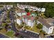Aerial view of condo complex showcasing building exteriors, ample parking, and pool at 4749 Wild Iris Dr. # 205, Myrtle Beach, SC 29577