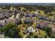 Aerial view showcasing condo location near a golf course, community pool, parking and common grounds at 4749 Wild Iris Dr. # 205, Myrtle Beach, SC 29577